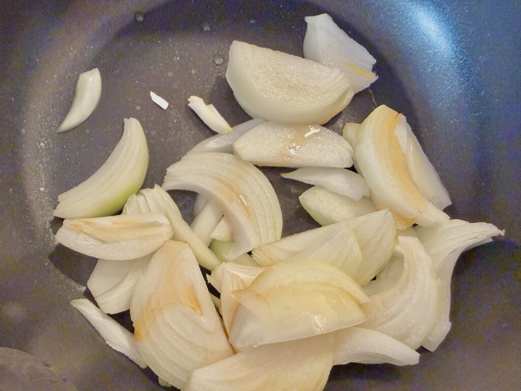 Shogayaki step: sauté onion in sesame oil