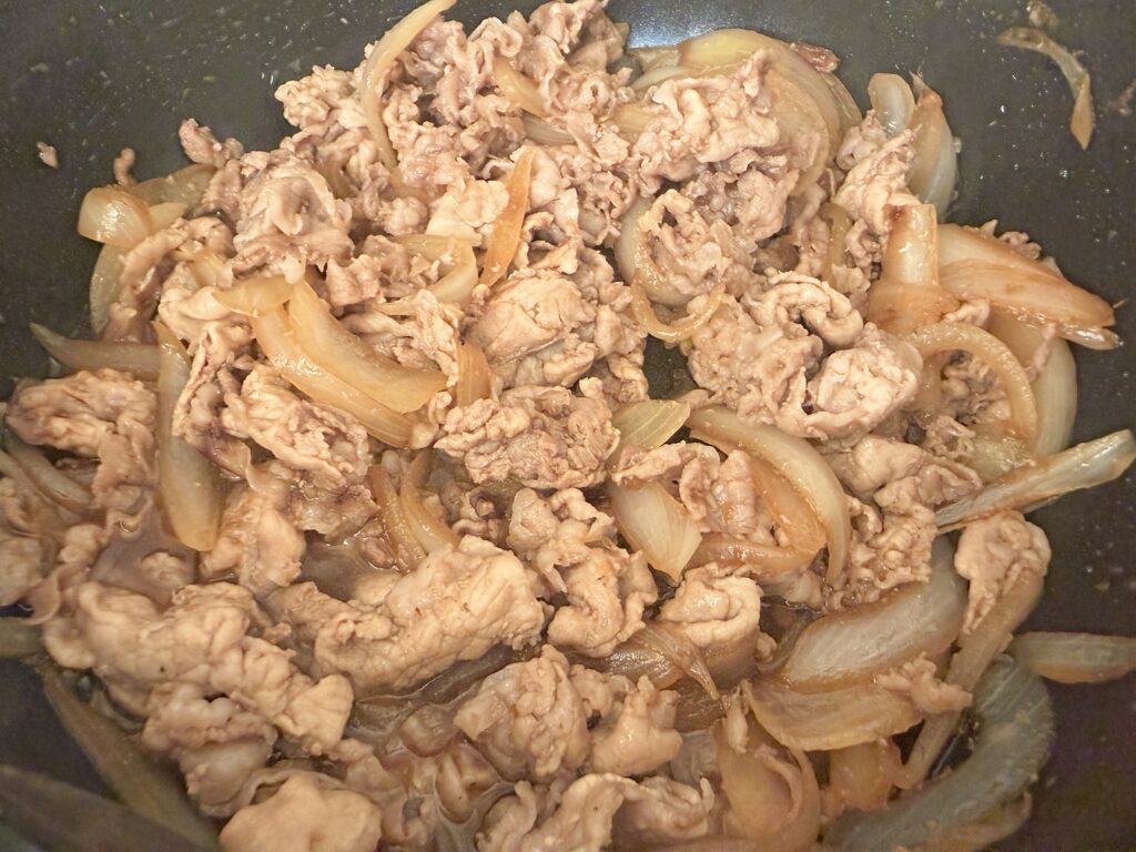 Japanese ginger pork (Shogayaki) finished: pork and onion coated in sauce