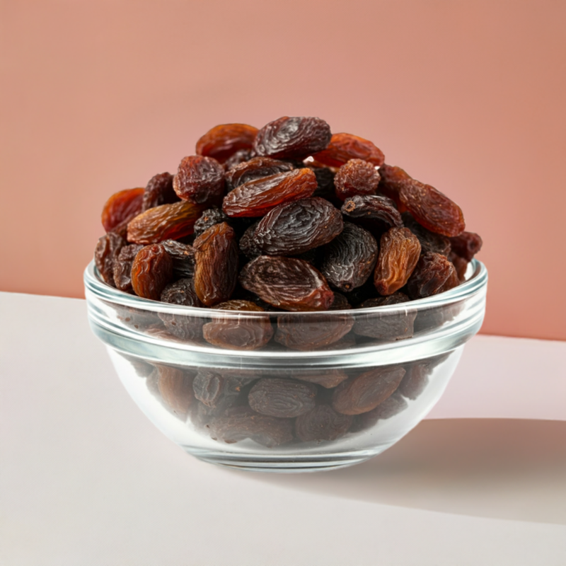 Organic raisins in a clear glass bowl