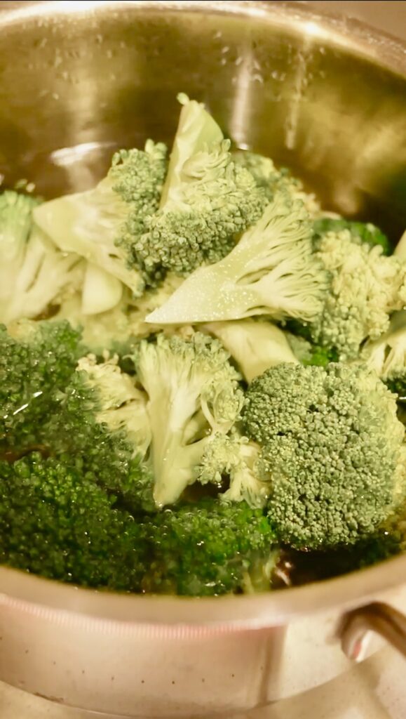 Broccoli florets boiling in salted water for a quick Japanese side dish