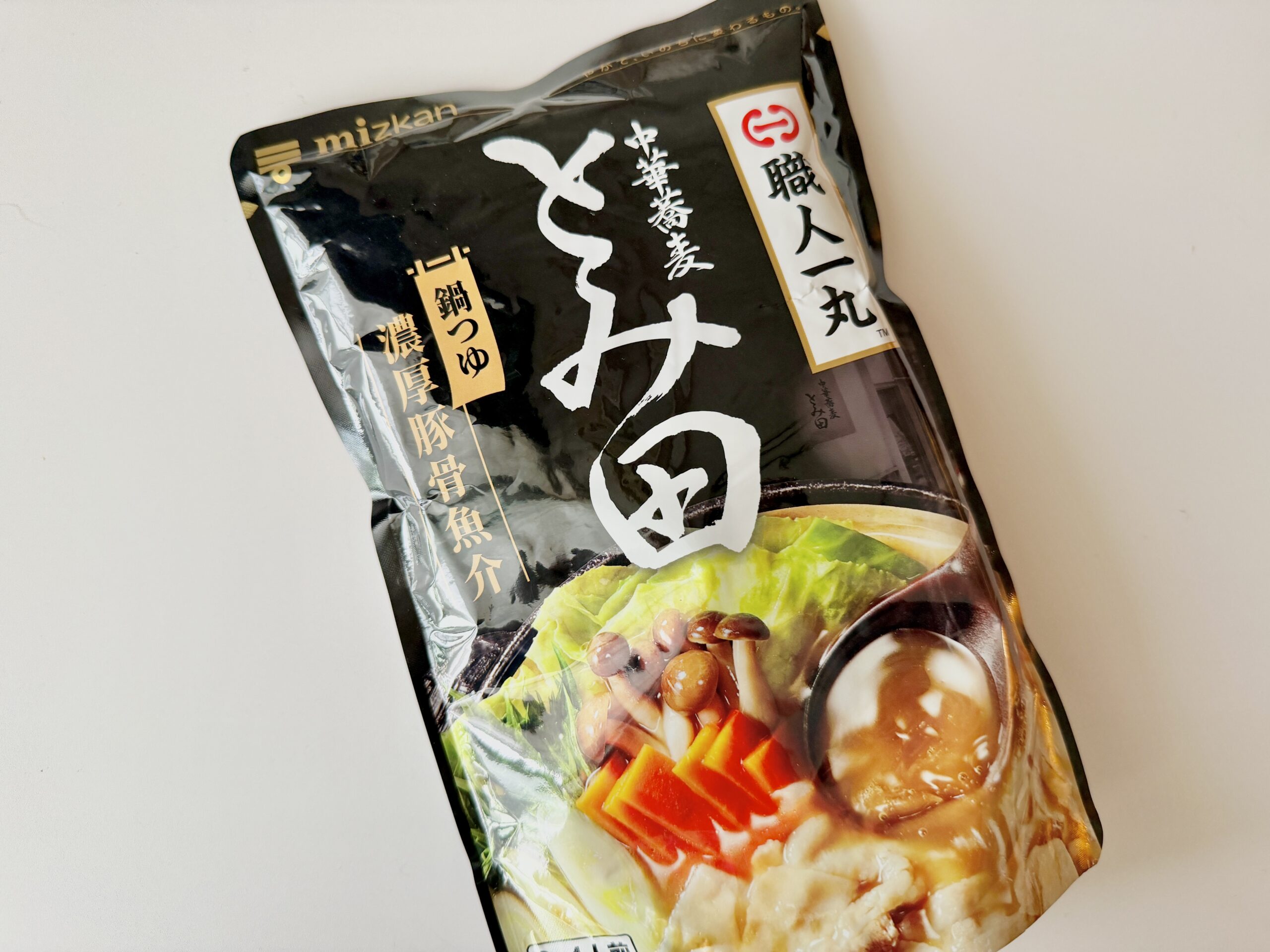 ミツカン 濃厚豚骨魚介鍋つゆ とみ田監修 パッケージ表面